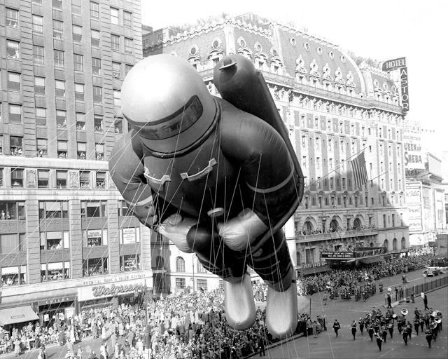 Helium-filled rubber space man, 70 feet tall, indicative of the latest adventure interest of America's kids, bobs along in 27th annual Macy's Thanksgiving Day parade, November 26, 1953.
