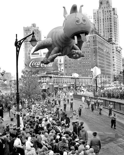 A big-headed dragon sails over Columbus Circle in 1961.