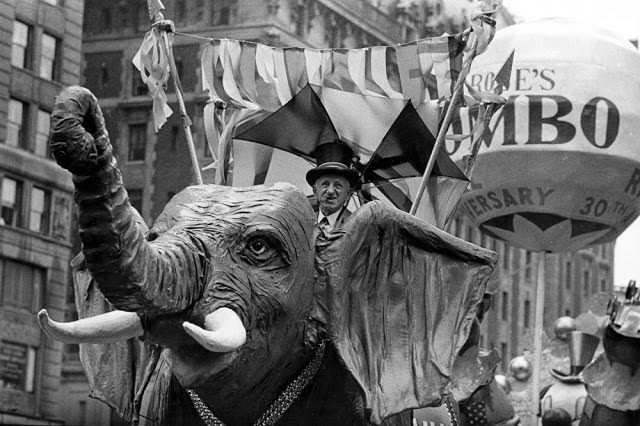 Comedian Jimmy Durante rides on a Jumbo the elephant float during the annual Macy's Thanksgiving Day Parade in New York City on Nov. 22, 1962.