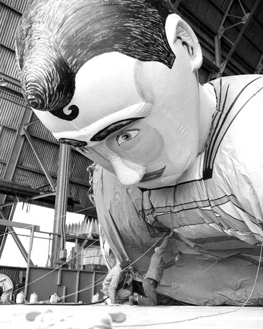 Workers fill Superman with helium for Macy's Thanksgiving Day parade in 1966