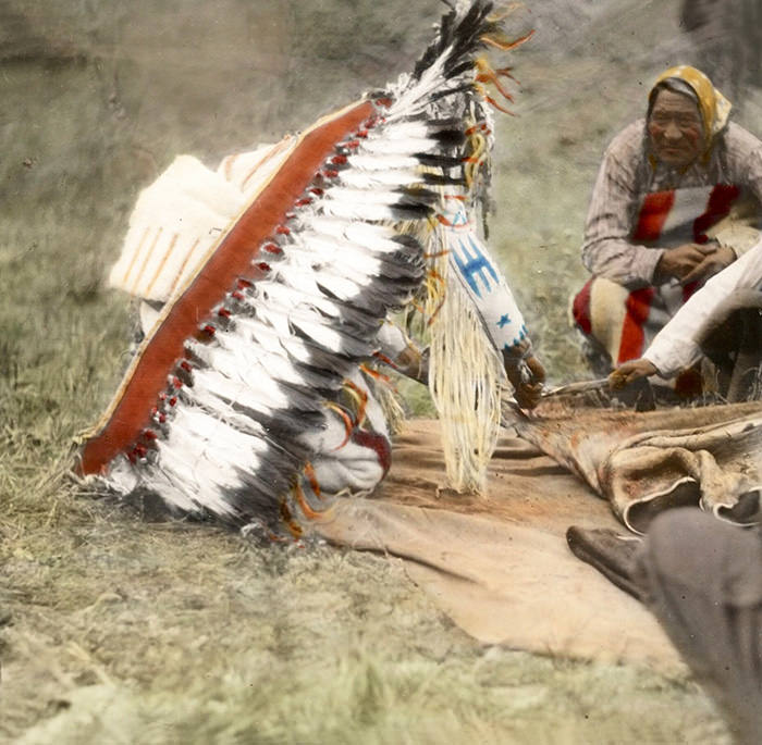 Bear Chief Cutting A Green Hide. Blackfeet. Montana. Early 1900s. Glass Lantern Slide By Walter