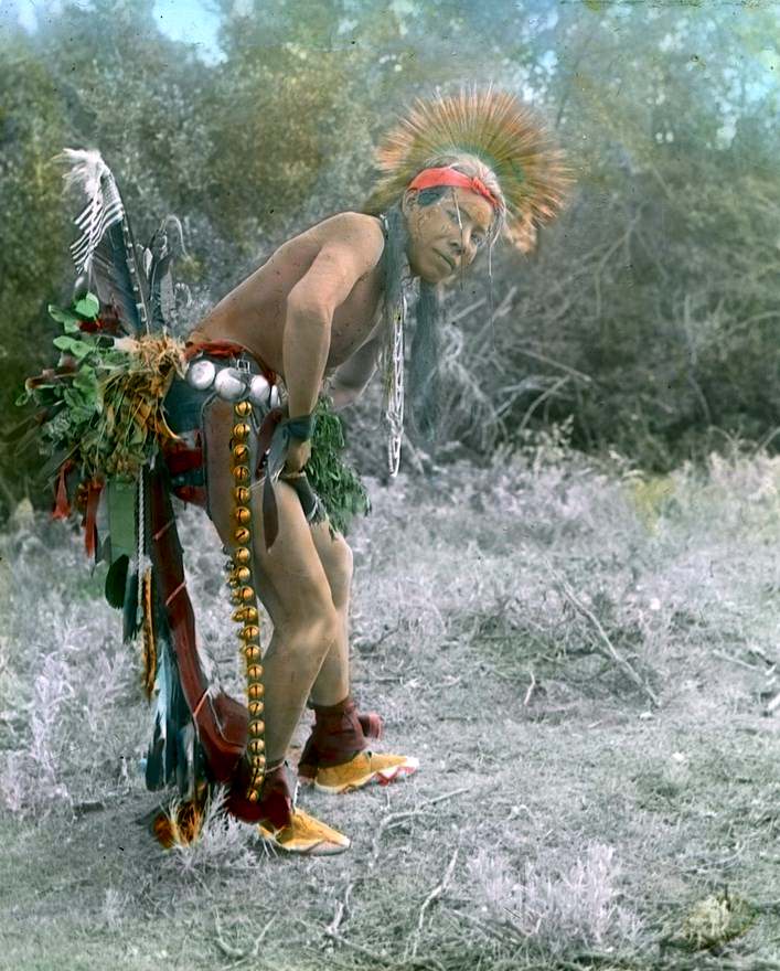 A Crow dancer. Early 1900s. Photo by Richard Throssel.