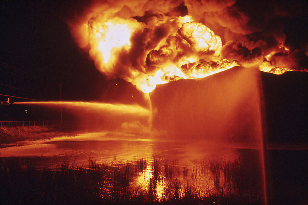 A Texaco crude oil tank blazes against the night after being struck by lightning, near Houston, September 1972. (Jim Olive/NARA)