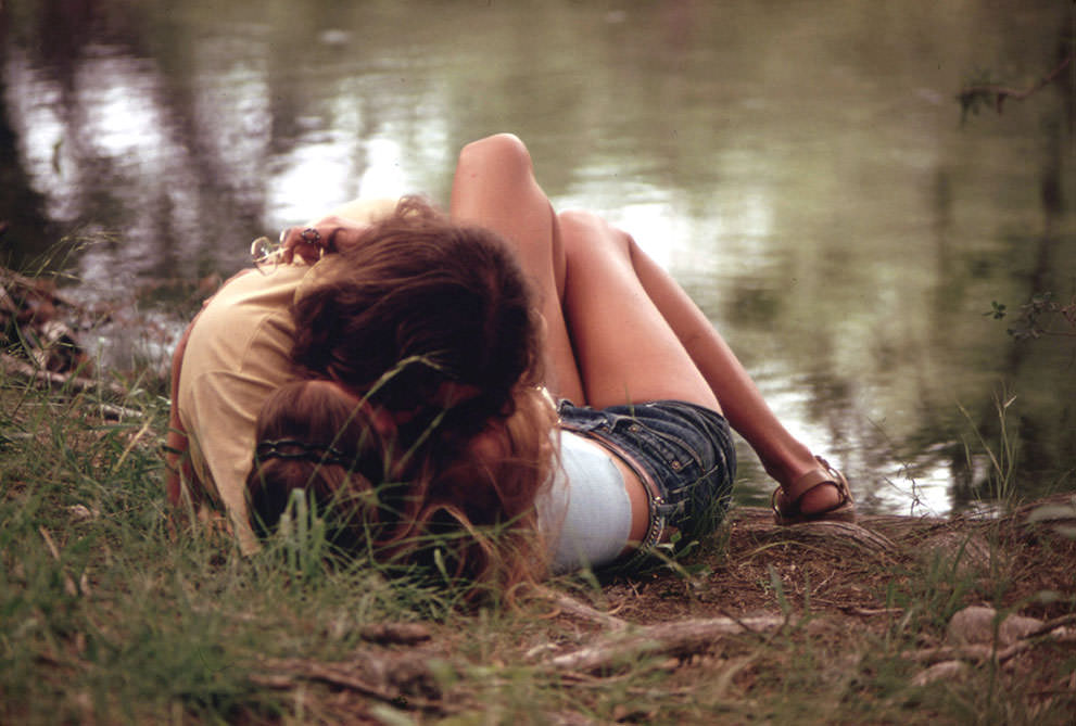 A teenage couple embraces on the bank of the Frio Canyon River near Leakey, May 1973. (Marc St. Gil/NARA