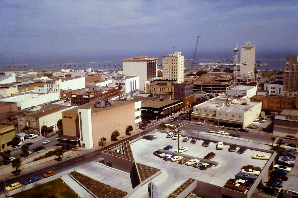 View from the Wilson Building looking down on the parking lot on top of a Bank of America drive-through bank (Mesquite and Schatzell St.), 1979