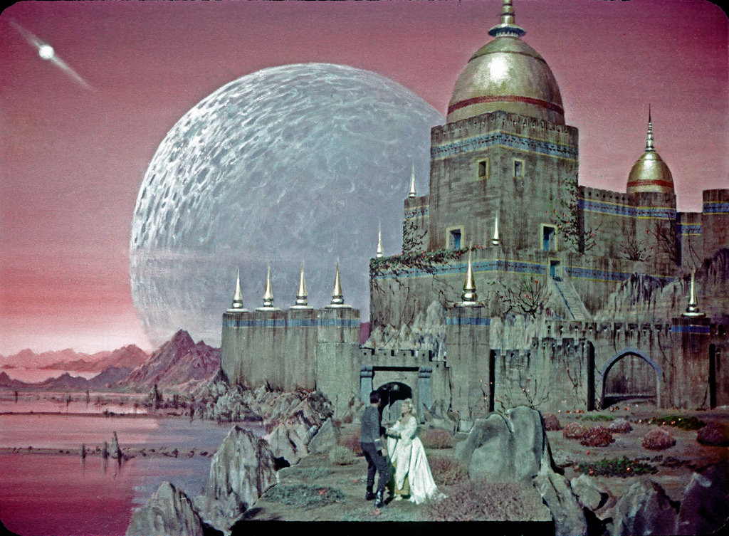 Iconic Star Trek TOS image, an illusion recreating a castle and battle with hostile warriors on Rigel VII, now with Vina to protect, as put in the mind of Christopher Pike by Talosians in the first pilot, The Cage.