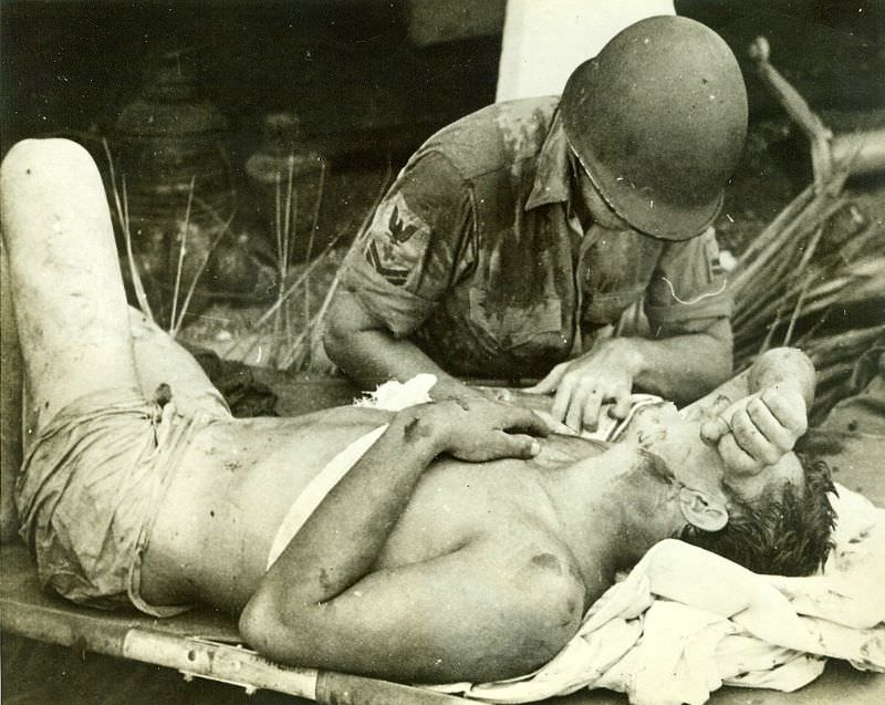 Survivor of U.S.S. Calhoun Gets First Aid