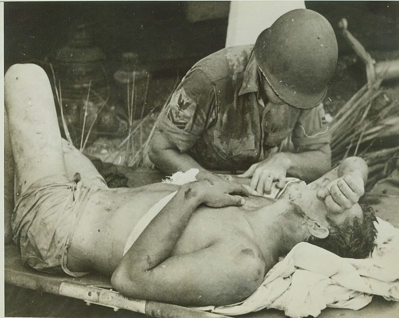 Survivor of U.S.S. Calhoun Gets First Aid, 1942