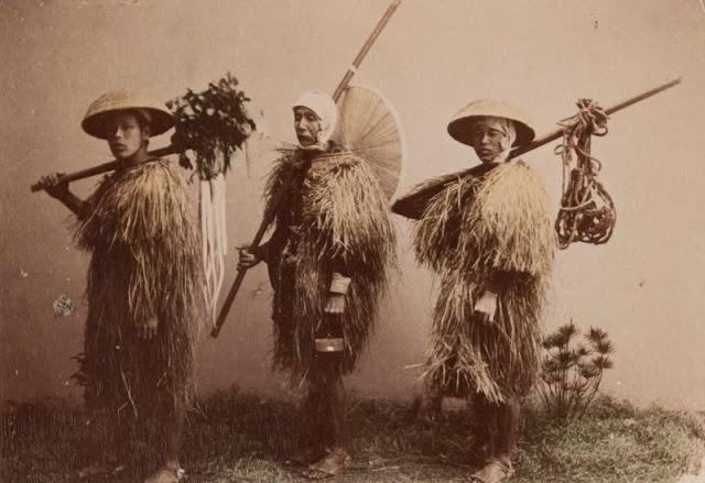 Farmers wearing rain-coats