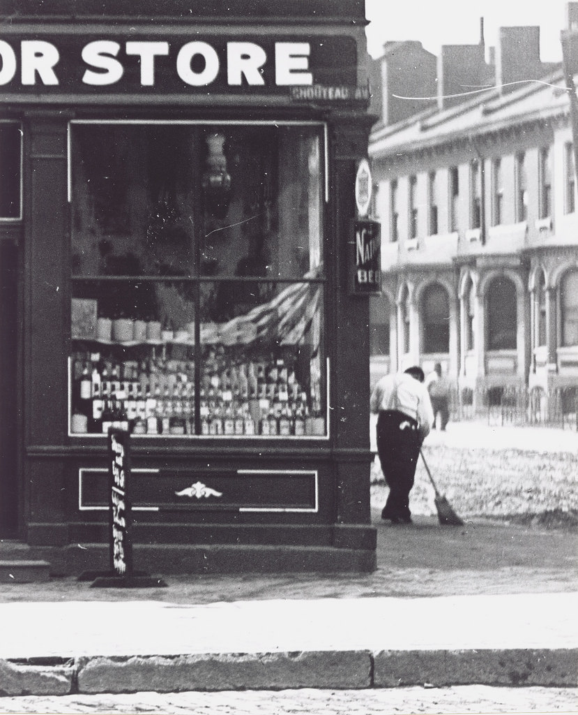 Store front window of a liquor store on Chouteau Avenue, ca. 1900s