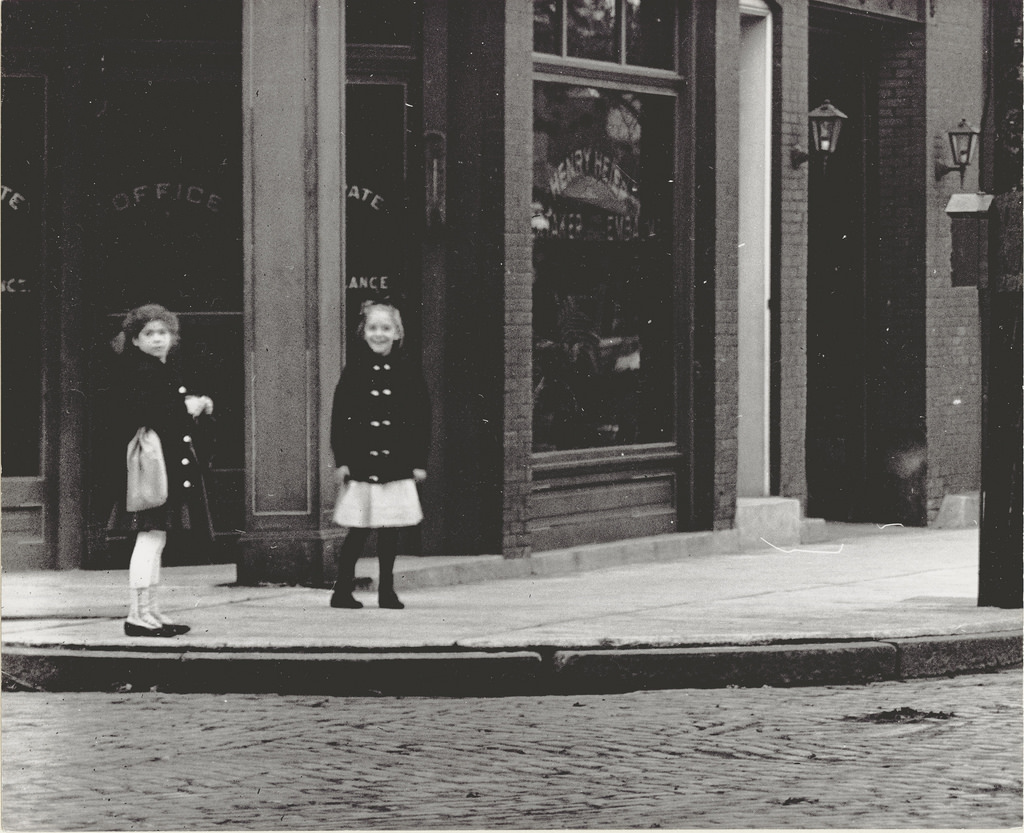 Two girls standing in front of Henry Heier Undertaker and Embalmer shop at 3432 Shenandoah Street, 1906