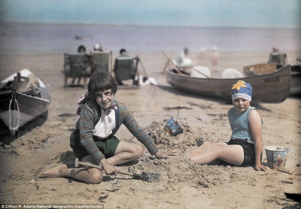Children play on the sand near Yarmouth, a popular destination for holidaymakers on the Isle of Wight in 1928