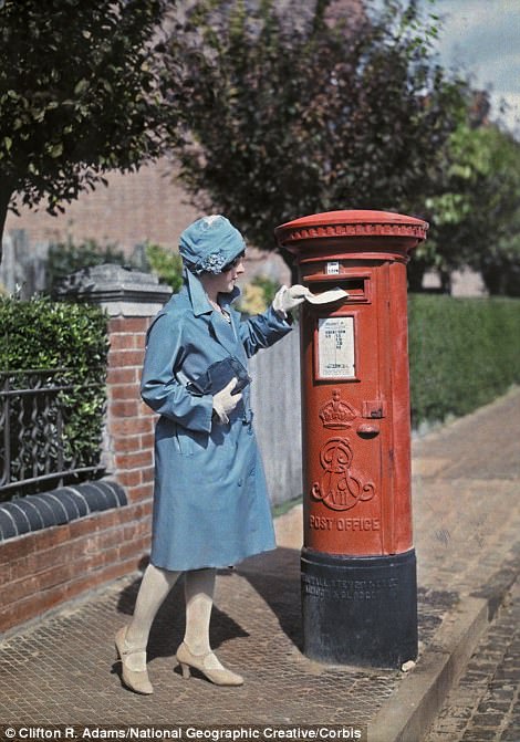 A woman posts a letter in Oxford in 1928