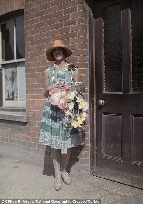 A woman sells artificial flowers for charity on Alexandra Day in Kent