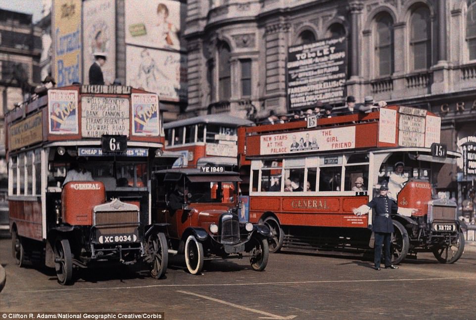 A policeman directs buses at the intersection of Trafalgar Square in the centre of London in 1929