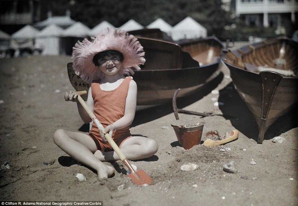 A young girl plays on the beach with bucket and spade in Sandown on the Isle of Wight in 1928