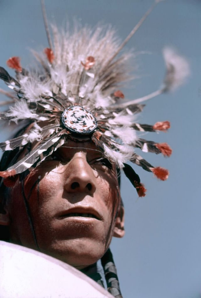 A member of a tribe participates in the parade.