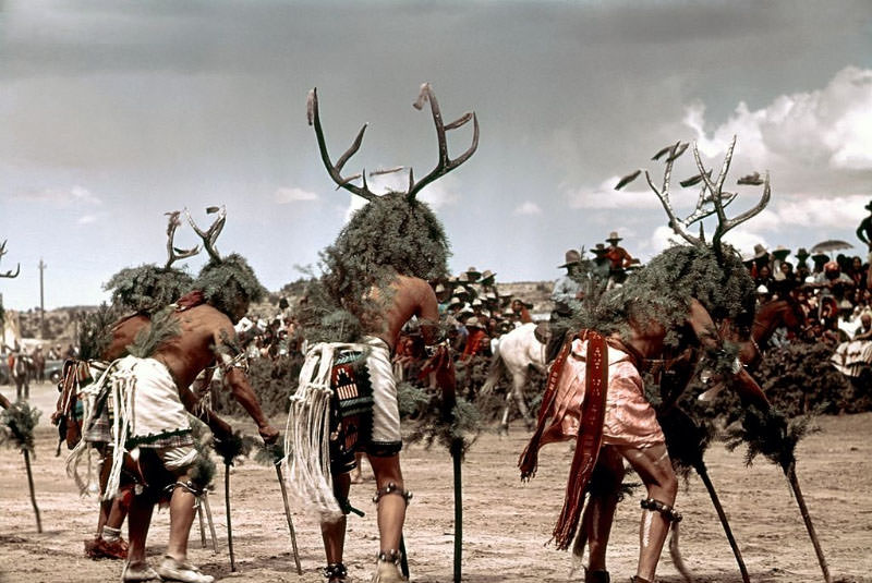 Native Americans from a tribe do a ceremonial dance.