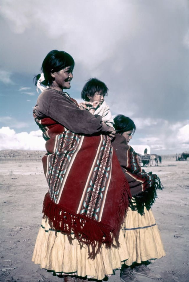 A Native American woman and her two children at the campgrounds.