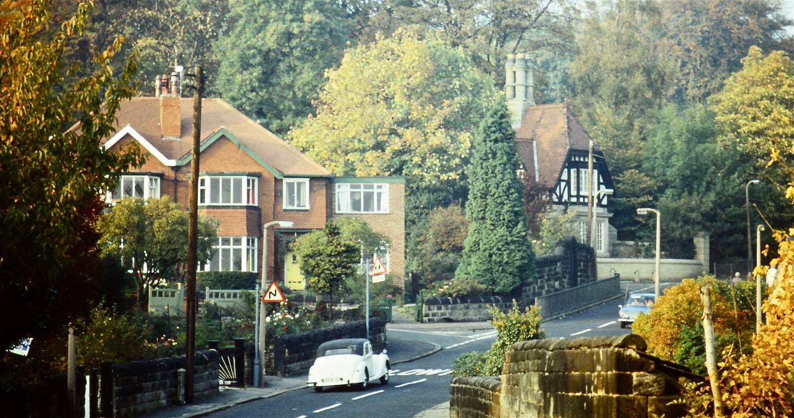 The leafy suburbs. Probably near Weetwood Lane, What is that wonderful white car?