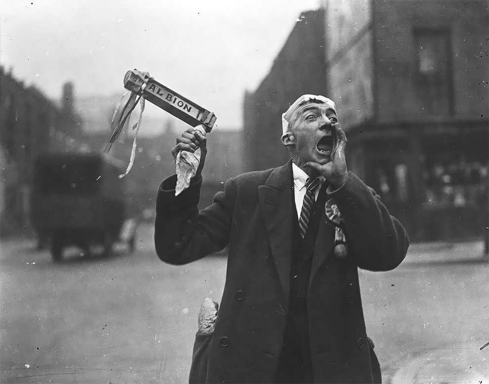 A West Bromwich Albion FC fan waves his rattle and cheers as he makes his way to Wembley Stadium for the FA Cup final between West Bromwich Albion and Sheffield Wednesday. Sheffield Wednesday won the match 4-2, 27th April 1935