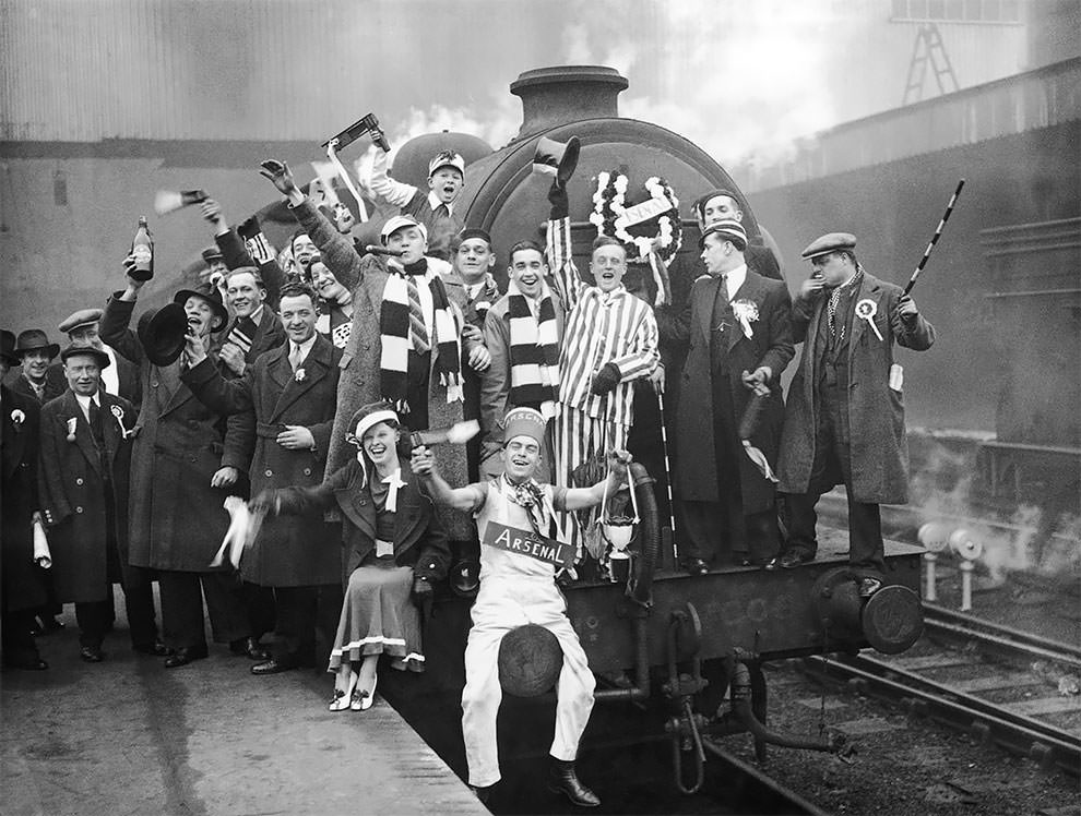 Arsenal fans at King’s Cross to catch the special trains to Huddersfield for the FA Cup semi final against Grimbsy, 21st March 1936. Arsenal won 1-0, 1936