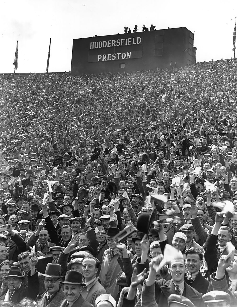 Crowds of supporters fill the stands at Wembley Stadium for the FA Cup Final between Preston North End and Huddersfield Town. Preston won 1-0 after extra time, 30th April 1938