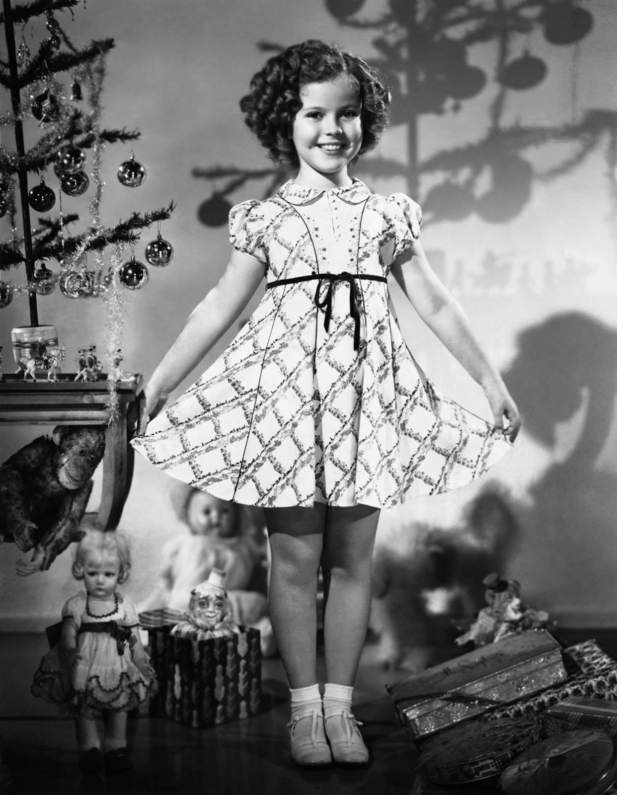Shirley Temple modeled a new Christmas dress in 1935.