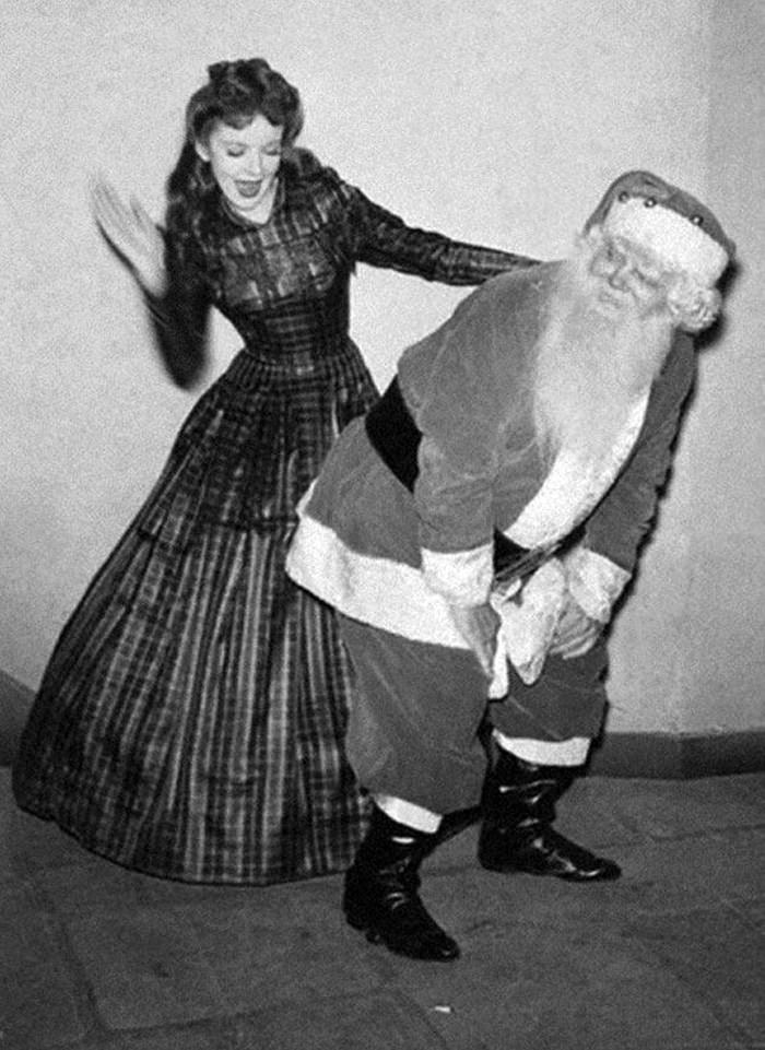 Ida Lupino, a Warner Brothers star, spanks Saint Nick, 1942.