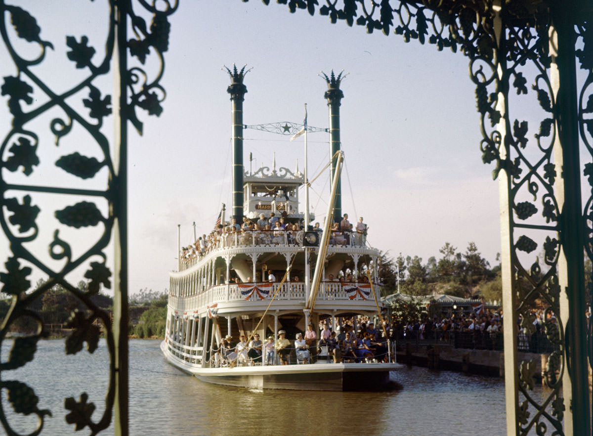 A crowded Mark Twain Riverboat sails at Disneyland in July 1955