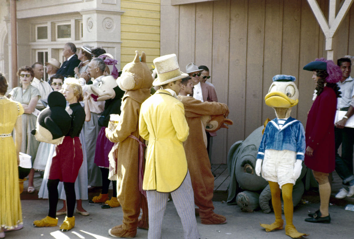 Parade participants and costumed Disney characters ready themselves for the televised grand opening of Disneyland on July 17, 1955