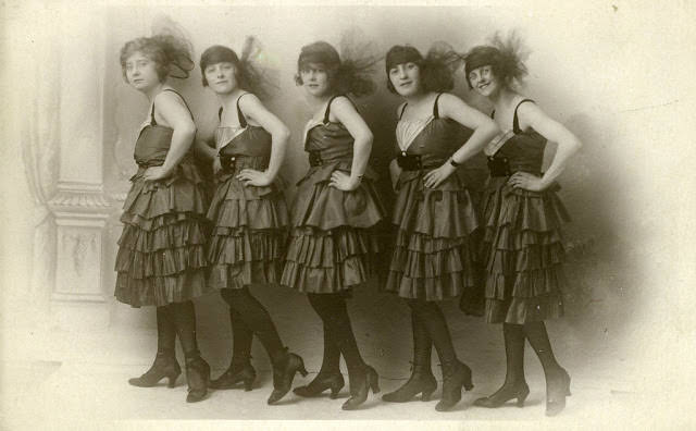 Five dancing girls in black