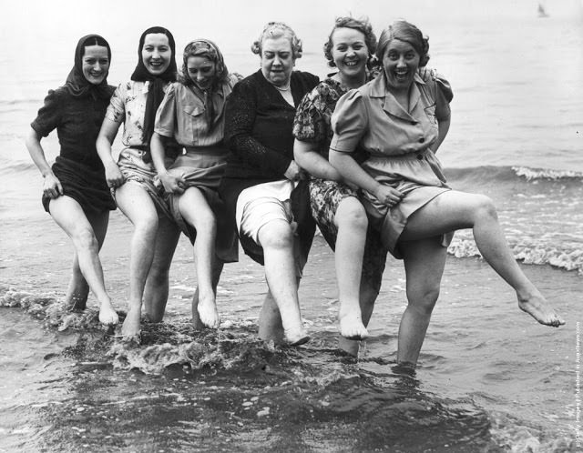 Music hall singer Florrie Ford cavorting in the sea at Morecambe in Lancashire with her companions