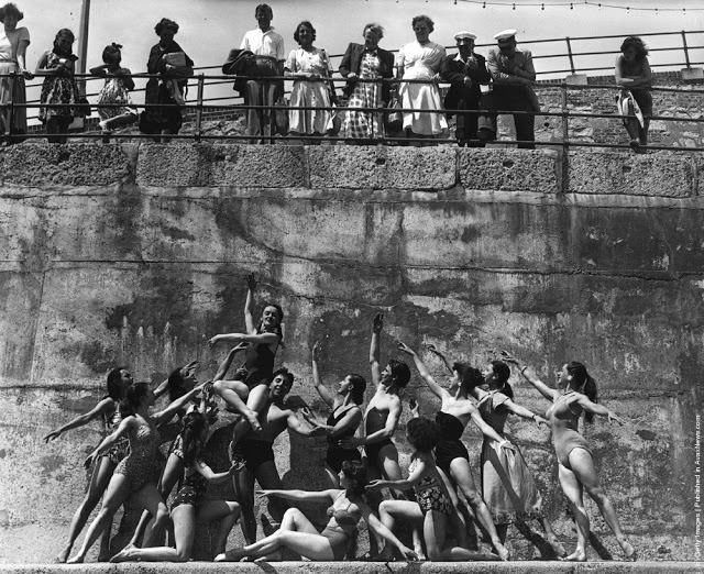 Members of the London Theatre Ballet Company form a frieze-like tableau on the beach at Eastbourne