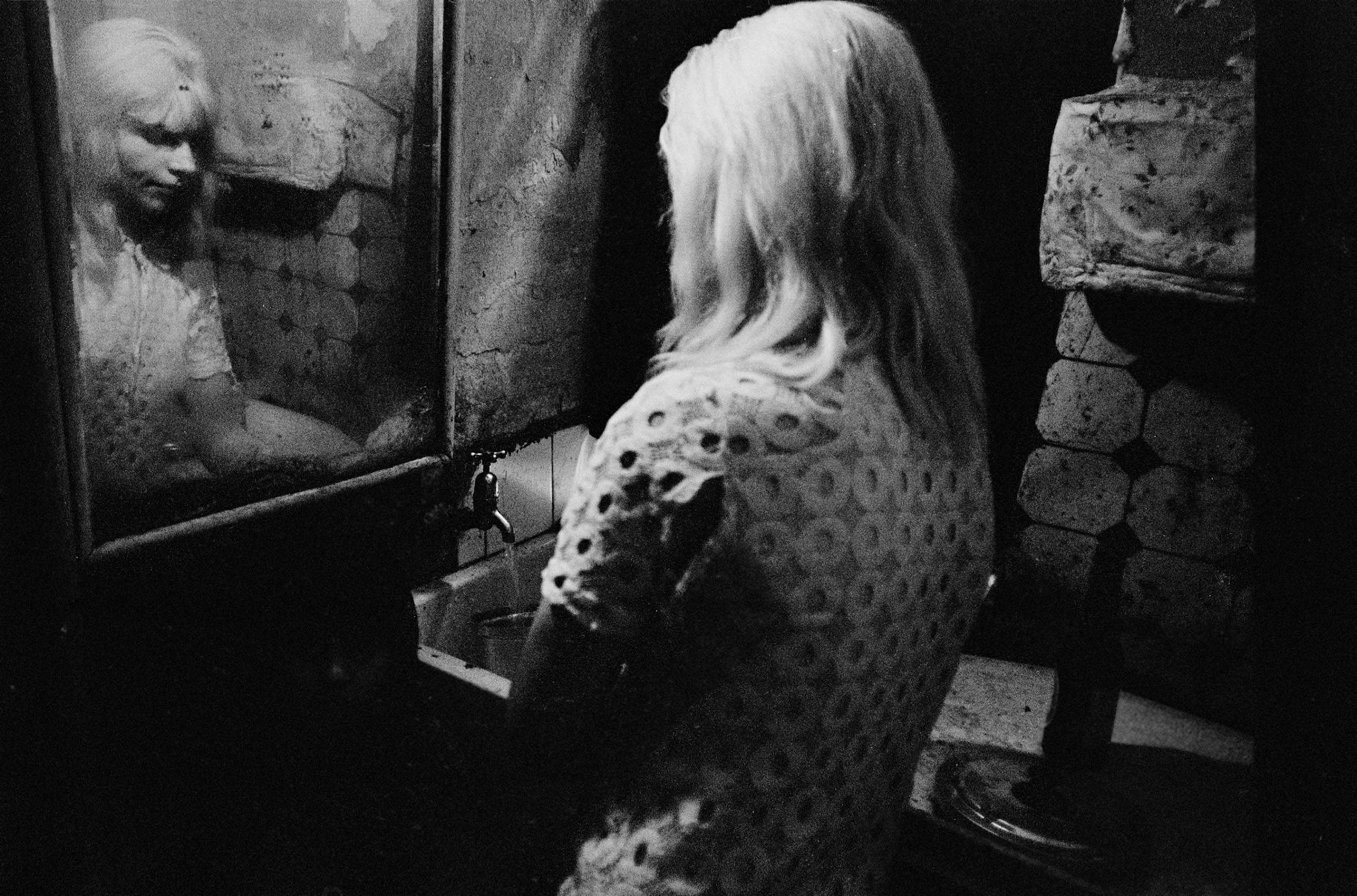 At the kitchen sink in a tenement flat Glasgow 1970