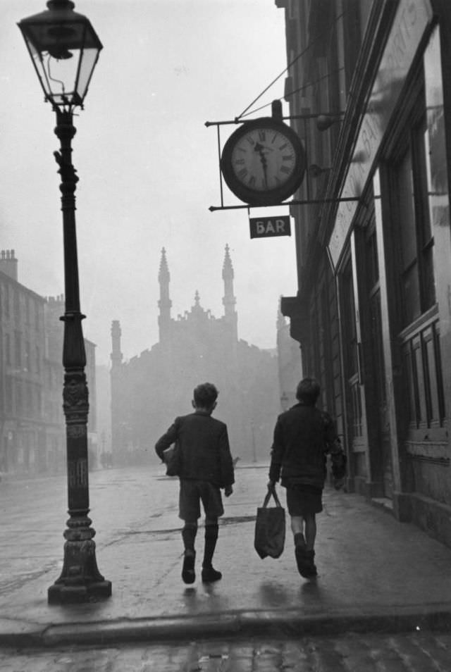 Two boys walking along a street in the run-down Gorbals