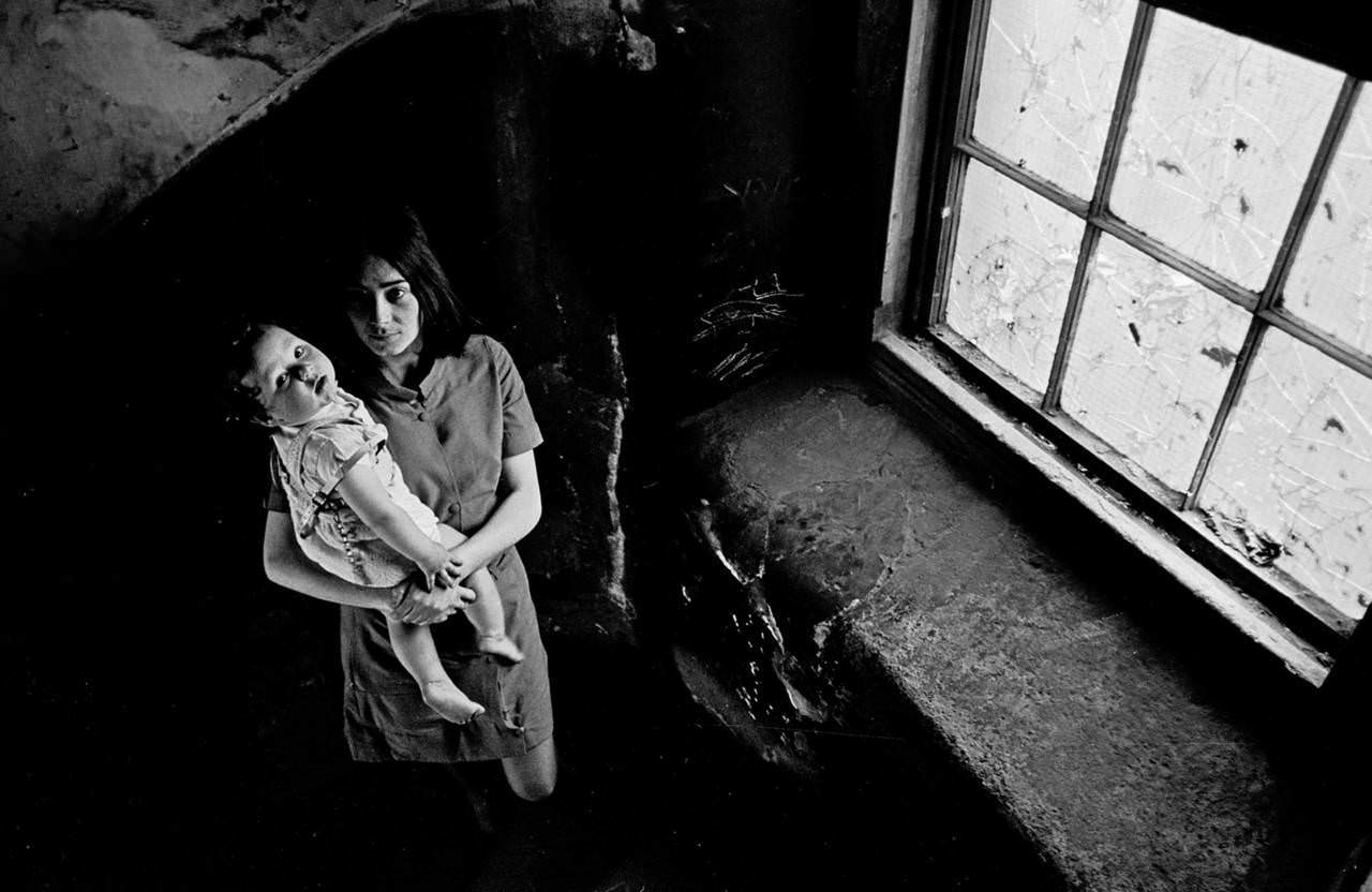 Mother and her baby on the staircase of her condemned Gorbals tenement 1970