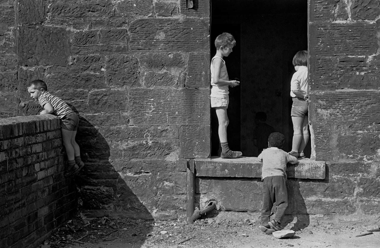 Children playing in an abandoned tenement Maryhill 1971