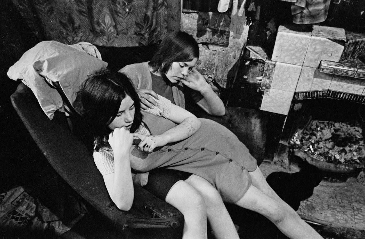 Teenage girls waiting in backyard of tenement block Maryhill 1971