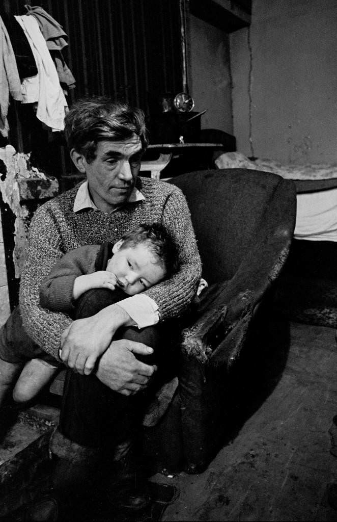 Father and babe in a Gorbals slum tenement 1970