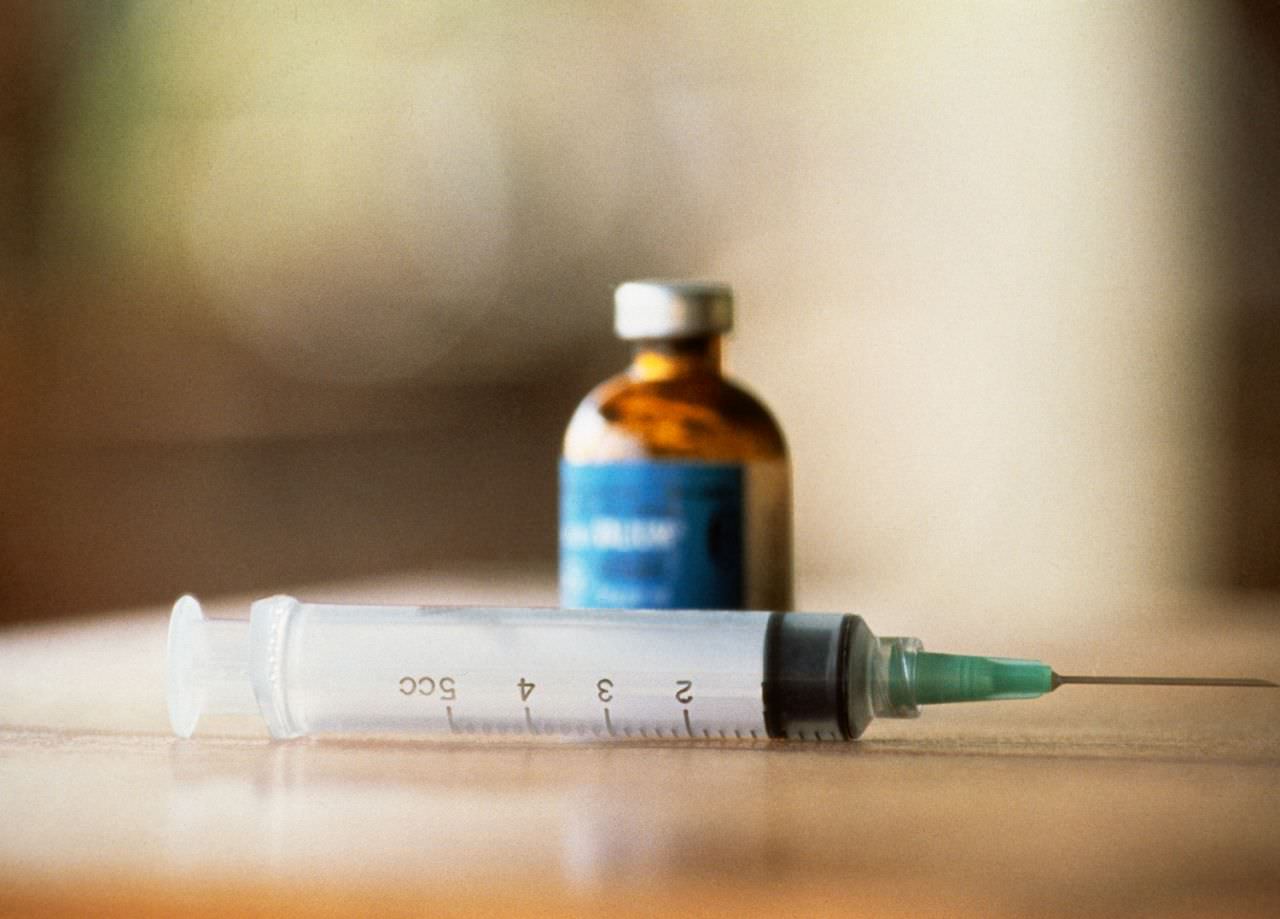 Bottle of poison and a syringe which belonged to members of the Peoples Temple cult, who participated in a mass suicide at Jonestown, Guyana on Nov. 18, 1978.