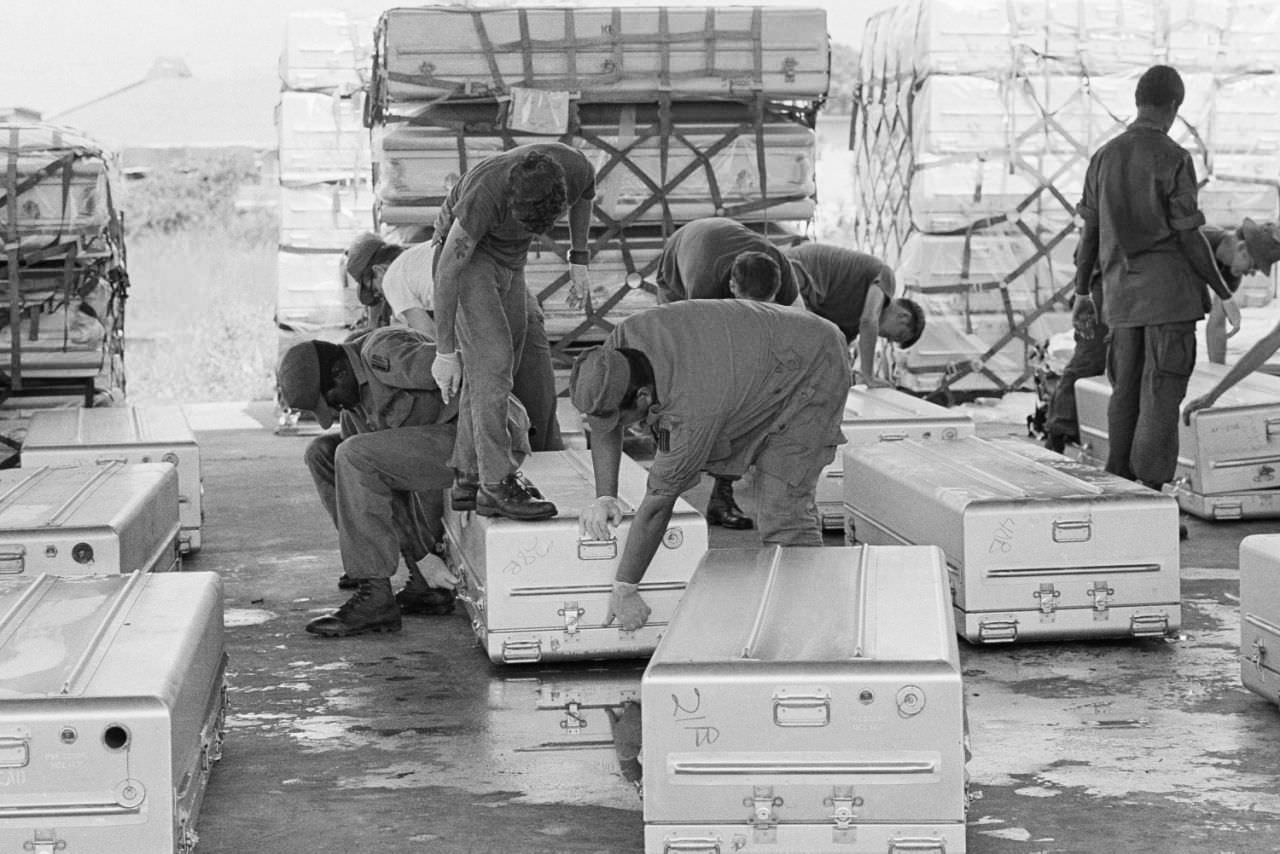 U.S. troops seal up shipping containers that hold the bodies of mass suicide victims from Jonestown