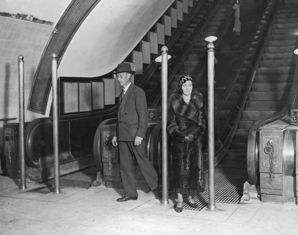 Passengers on an escalator, September 1932. The posts were erected to avoided a crush during rush hours.