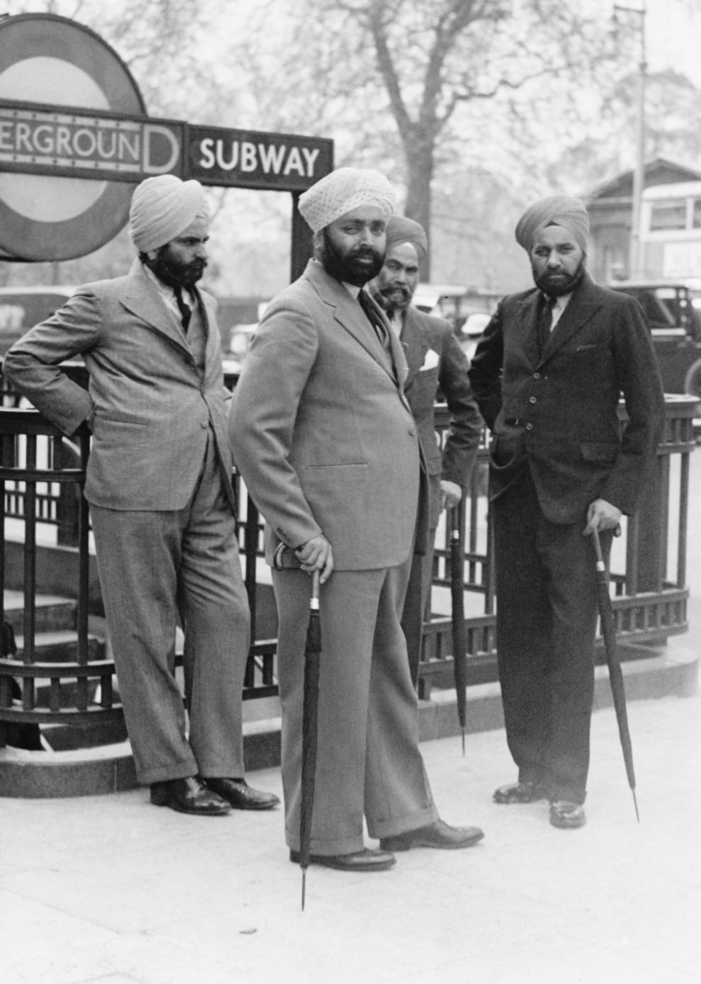 A group of Sikh men outside the entrance to Hyde Park Corner, ca. 1935.