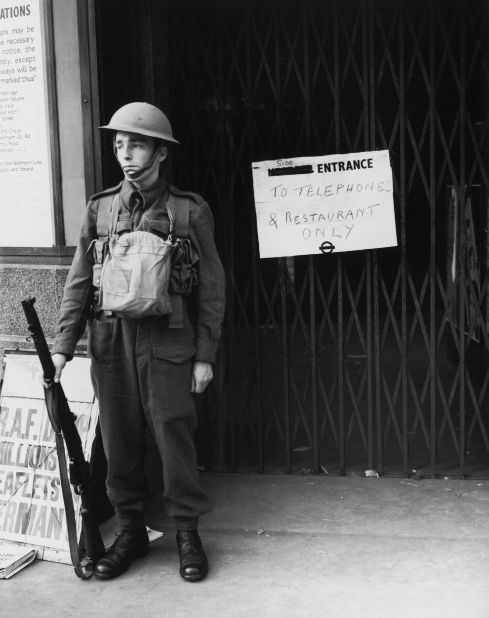 A guard outside a station which has been closed to the public two days after Britain’s declaration of war on Germany, 5th September 1939.