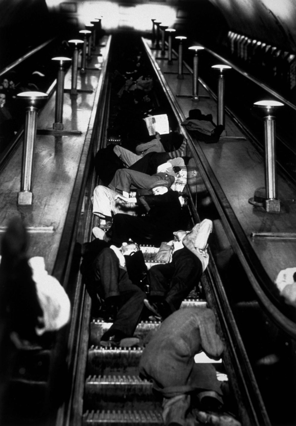 People asleep on the escalators at Piccadilly Tube Station, London, during an air raid, 1940.