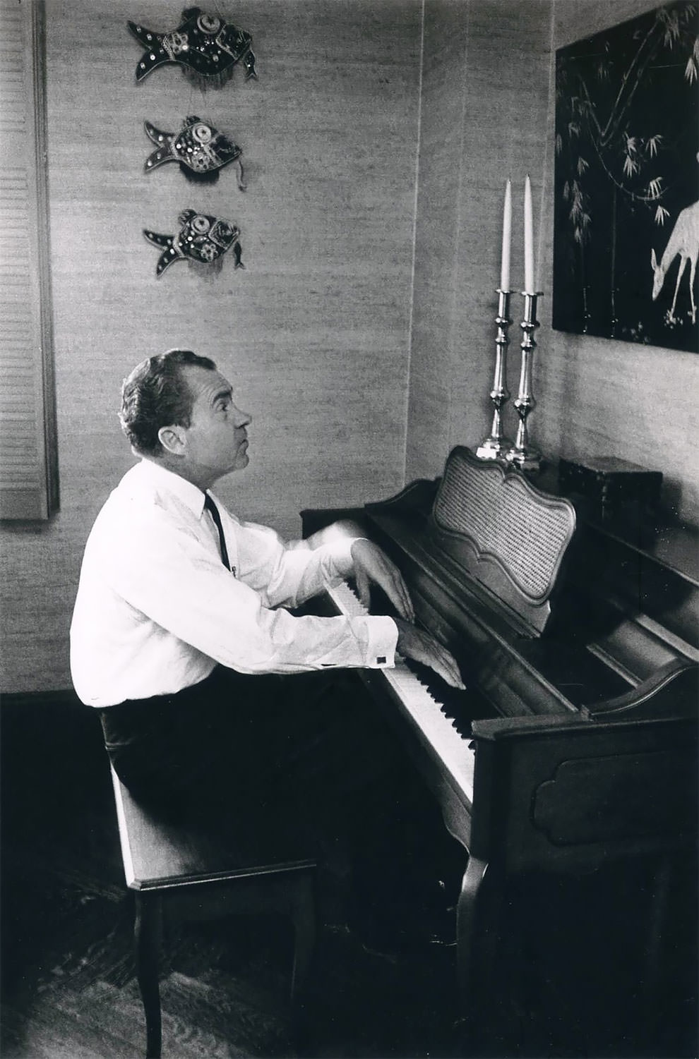 The 37th President of the U.S. Richard M. Nixon plays the piano. USA, New York City, 1966.