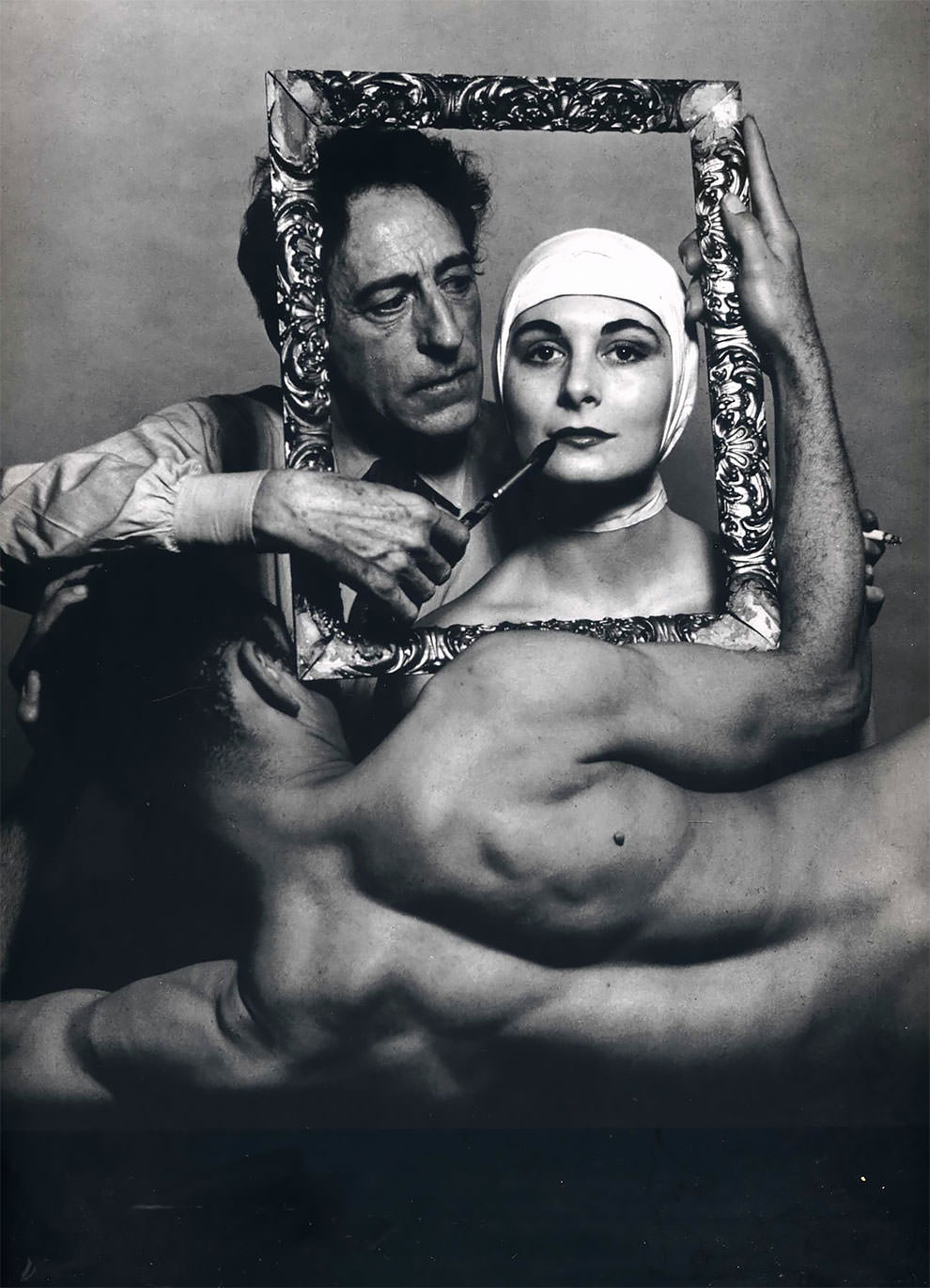 French poet, artist and filmmaker Jean Cocteau with actress Ricki Soma and dancer Leo Coleman. USA, New York City. 1949.