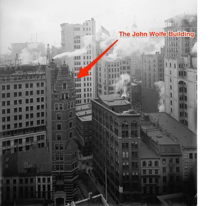 The John Wolfe Building was built in 1895 in the Financial District. It was demolished in 1974 to widen the street.