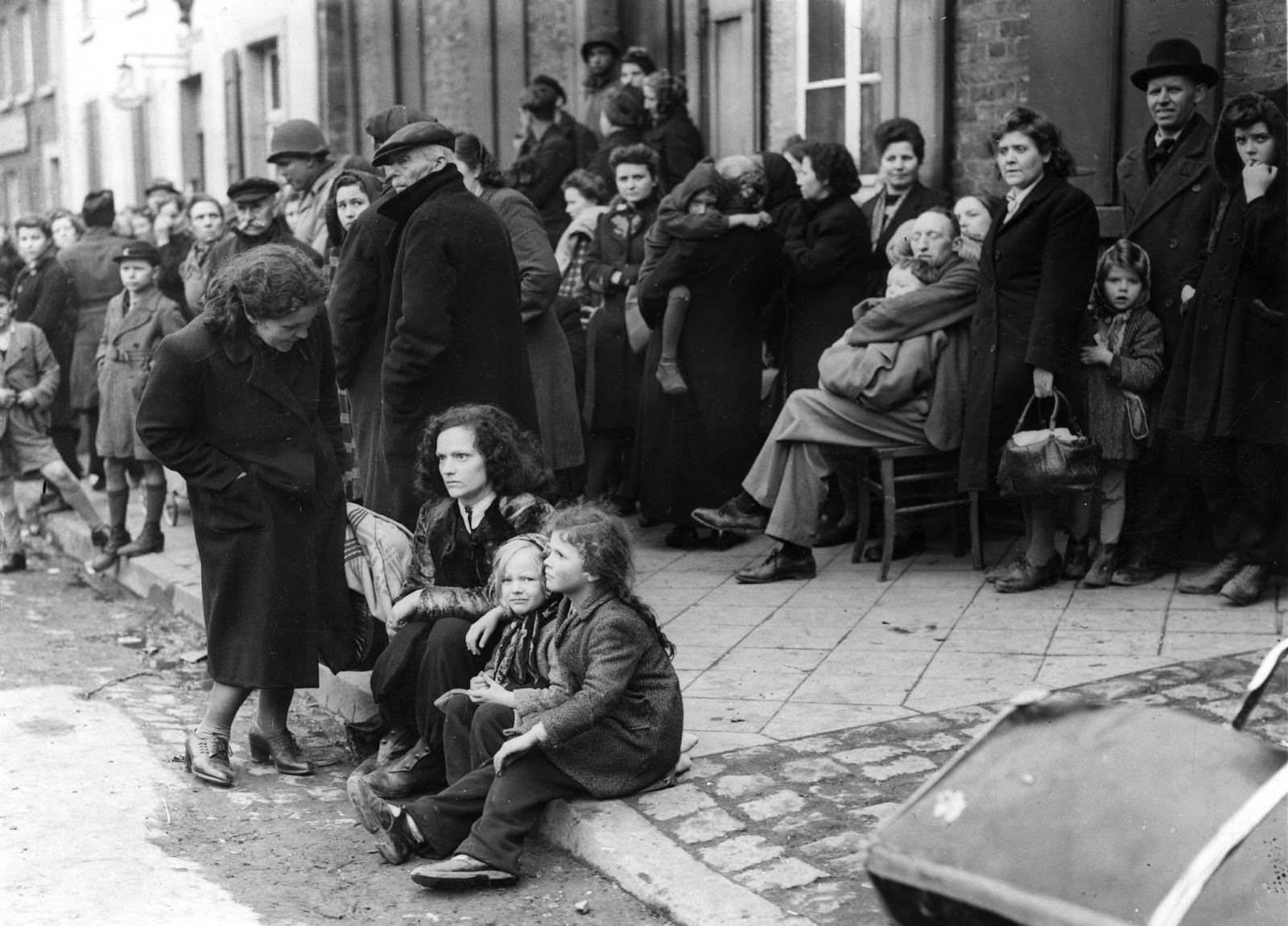 German refugees crowding the market square on Mar. 3, 1945, at Juchen, Germany, a town captured by the U.S. Army at the end of the Second World War.